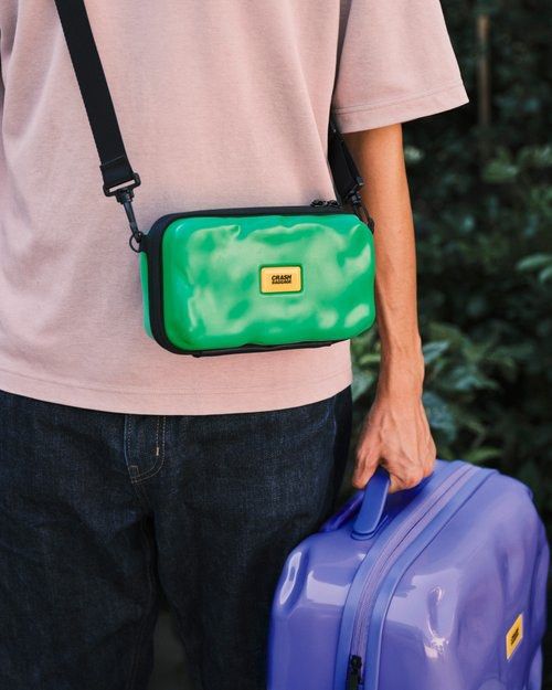 Authentic Crash Baggage Crossbody Bag - Green (Category: Sling Bags) located in Manila. Submitted by whosewhoo (Listing ID 1435091075, Image 2). Description: - Crash Baggage crossbody bag - Vibrant green exterior - Black adjustable strap - Rectangular shape - Small yellow logo - Compact size for essentials - Zipper closure.