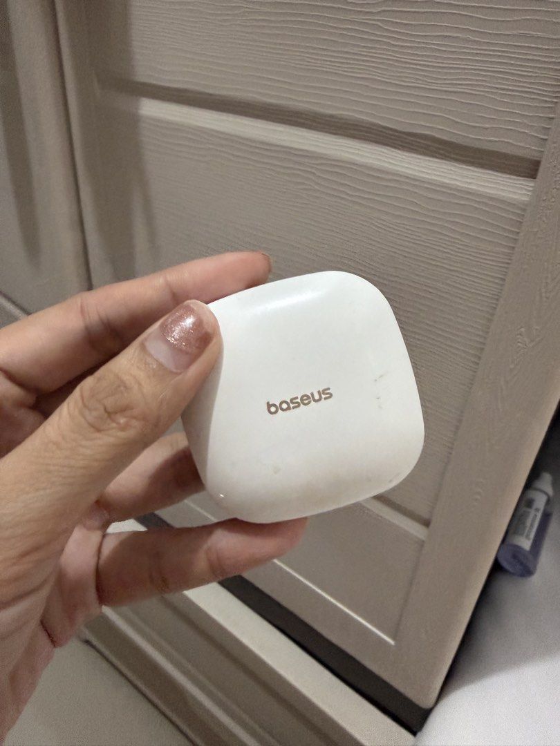 Baseus Wireless Earphones (Category: Earphones) located in Davao. Submitted by fabdeclutter (Listing ID 1435086445, Image 1). Description: - Baseus wireless earphones - Color: White - Includes charging case - Earphones marked with L and R - Baseus logo on the case - Ready to use.