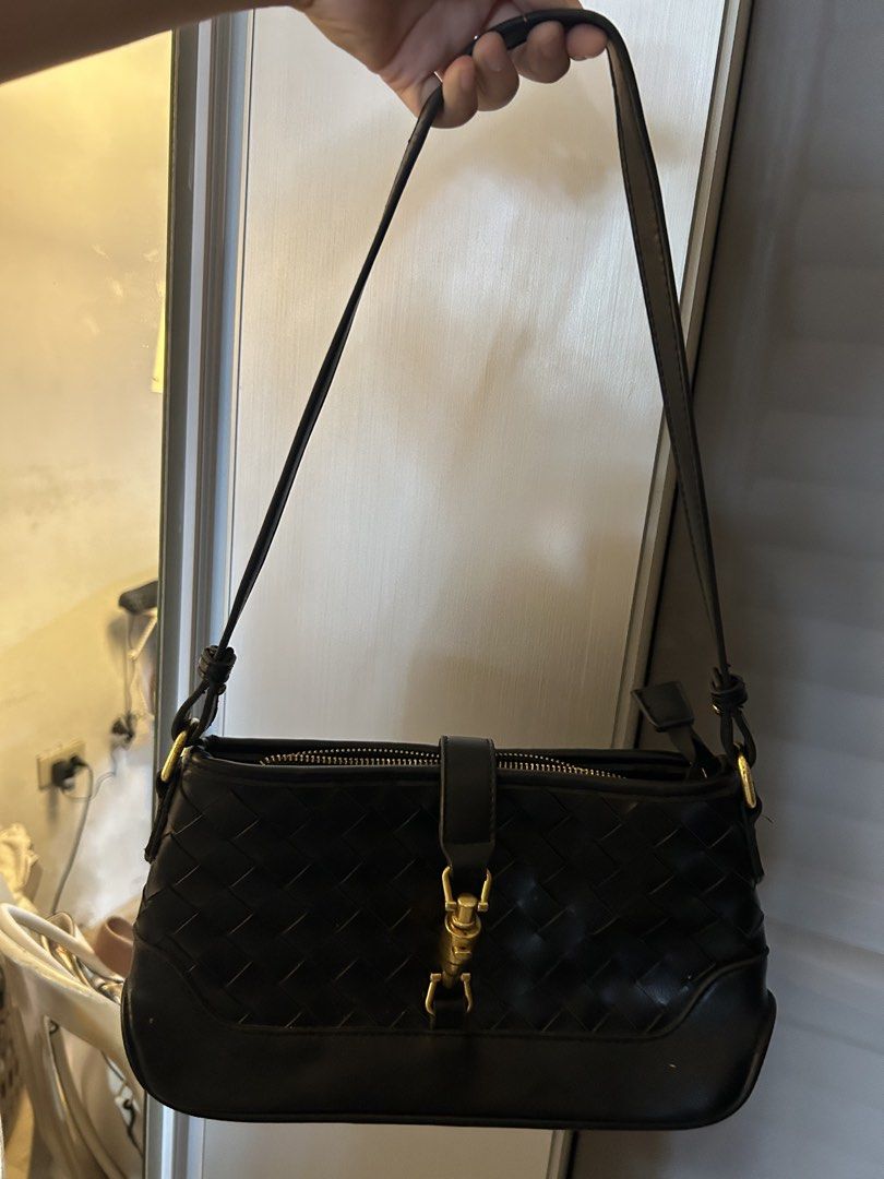 Black Shoulder and Kili Bag (Category: Shoulder Bags) located in Legazpi City. Submitted by prezeya (Listing ID 1435055019, Image 2). Description: Buy two items and receive a free gift ! 🎁 - Black shoulder bag - Woven design - Gold-colored clasp and zipper - Detachable shoulder strap - Black interior with small pocket - Made of leather or leather-like material.