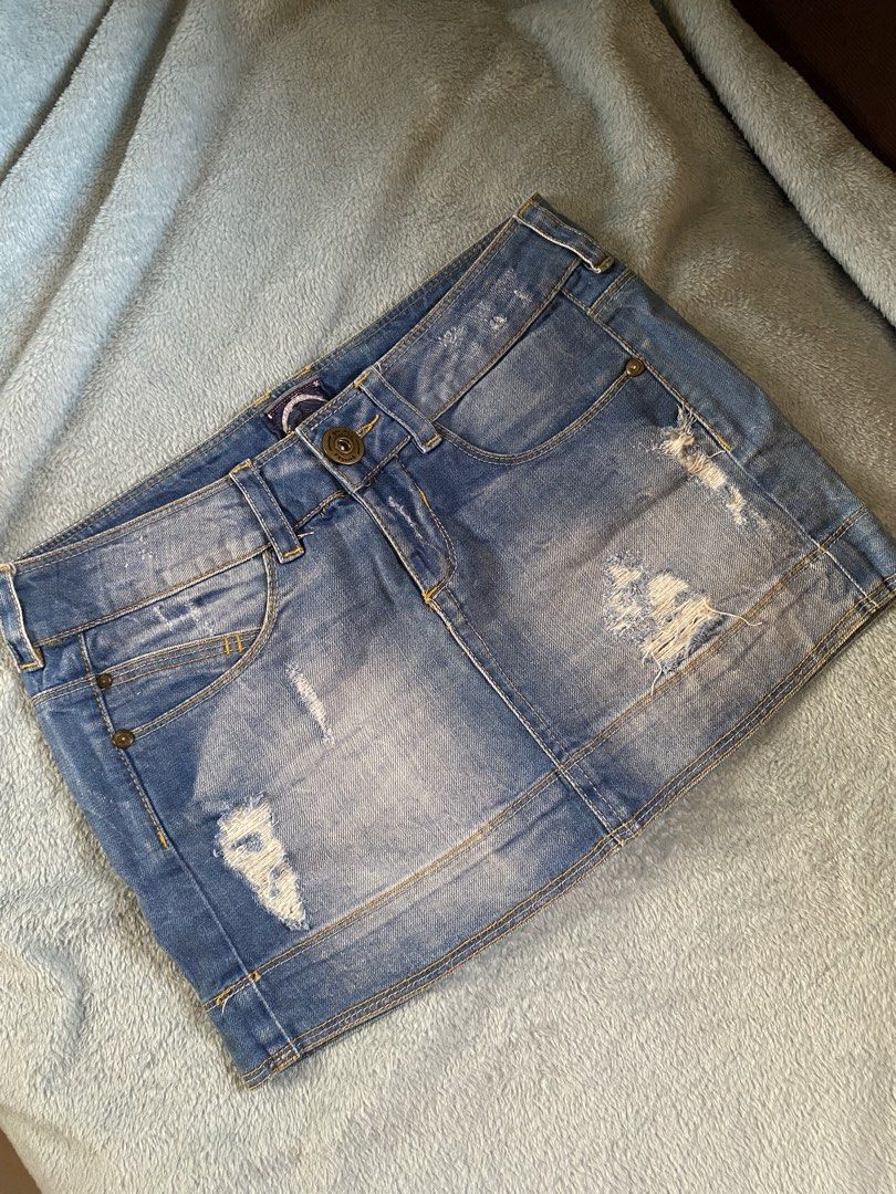 Blue Distressed Denim Mini Skirt (Category: Skirts) located in General Trias. Submitted by erssss22 (Listing ID 1435058179, Image 1). Description: - Light blue denim mini skirt - Distressed design - Button and zipper closure - Front and back pockets - Size 25-26.
