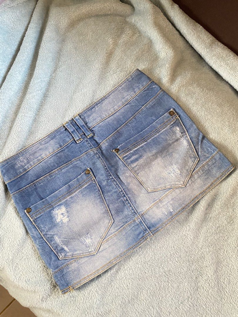 Blue Distressed Denim Mini Skirt (Category: Skirts) located in General Trias. Submitted by erssss22 (Listing ID 1435058179, Image 2). Description: - Light blue denim mini skirt - Distressed design - Button and zipper closure - Front and back pockets - Size 25-26.