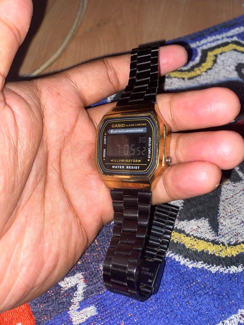 Vintage Casio Digital Watch (Category: Men's Watches) located in San Jose del Monte. Submitted by dripfromthrift2 (Listing ID 1435168174, Image 1). Description: - Casio digital watch - Black metal strap - Gold-colored case - Alarm function - Chronograph (chrono) function - Illuminator function - Displays time and date - Water-resistant - Casio logo and model information on the back.