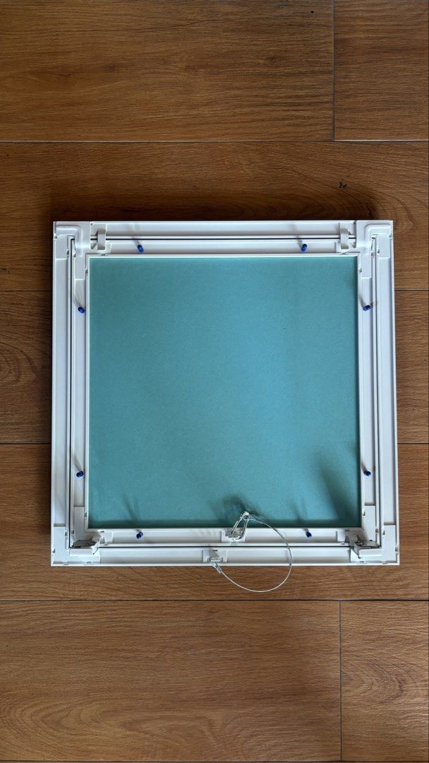 Ceiling Access Panel / Manhole (Category: Construction & Building Materials) located in Pasig City. Submitted by shiroshonen (Listing ID 1435071416, Image 1). Description: - White access panel - Teal-colored interior - Hinged design with metal wire support - Rectangular shape - Made of sturdy material - Features blue clips for secure closure - Ideal for covering wall or ceiling openings.