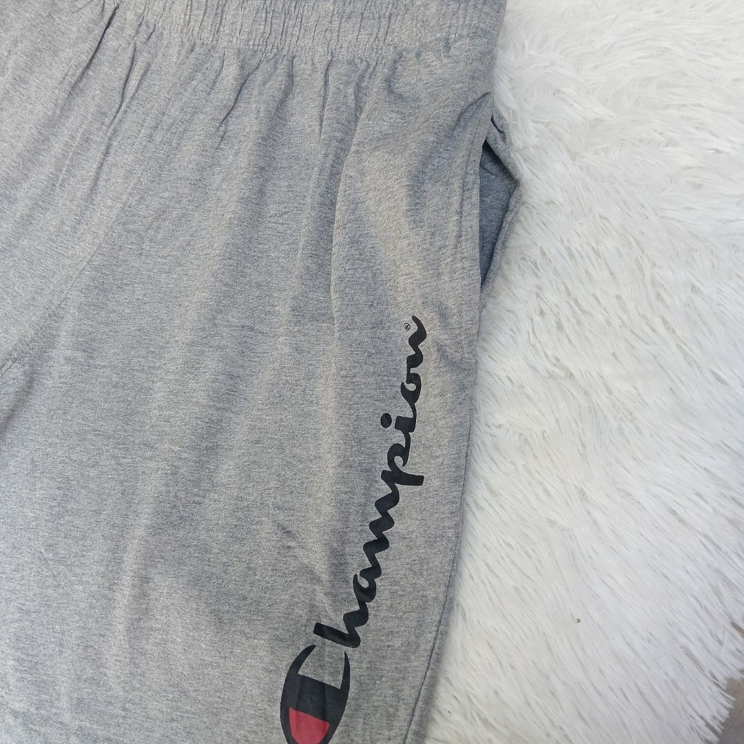 Champion Athletic Shorts - Gray - Large on TAG (Category: Shorts) located in Mercedes. Submitted by trendz_thrift_shop (Listing ID 1435082337, Image 2). Description: CODE: A097 - Waistline: 30-34 inches - Length: 18 inches - Champion athletic shorts - Color: Gray - Size: Large - Features Champion logo - Elastic waistband - Made in China.