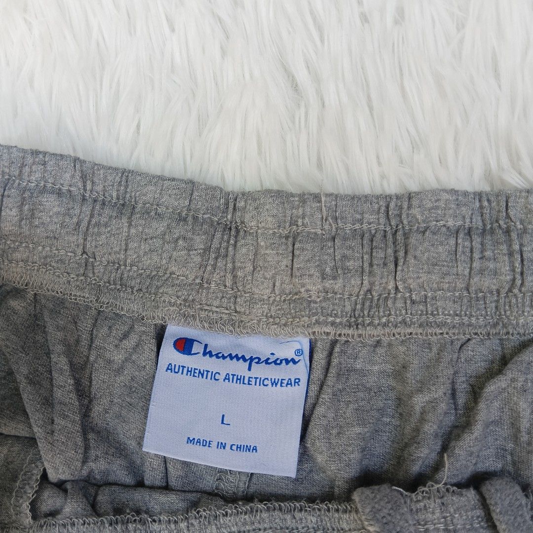 Champion Athletic Shorts - Gray - Large on TAG (Category: Shorts) located in Mercedes. Submitted by trendz_thrift_shop (Listing ID 1435082337, Image 3). Description: CODE: A097 - Waistline: 30-34 inches - Length: 18 inches - Champion athletic shorts - Color: Gray - Size: Large - Features Champion logo - Elastic waistband - Made in China.