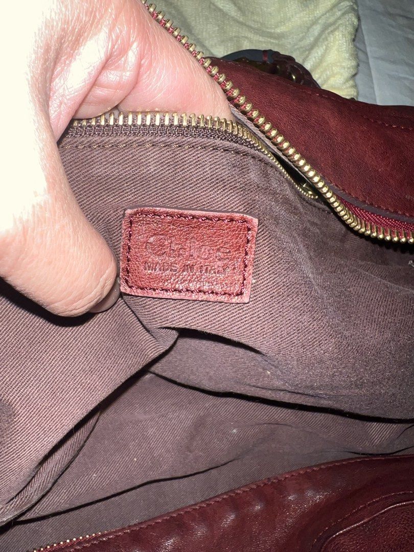 CHLOE Leather Handbag with Braided Straps (Category: Luxury Bags & Wallets) located in Cabanatuan. Submitted by prelovedtrinkets2023 (Listing ID 1434508508, Image 2). Description: - OG Burgundy leather handbag - Braided straps - Zippered closure - Gold-toned hardware - Spacious interior - Classic design - Suitable for everyday use.