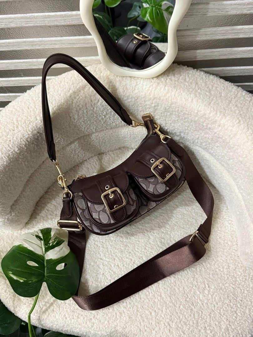 Coach Double Pocket Shoulder Bag (Category: Luxury Bags & Wallets) located in Quezon City. Submitted by icon.deluxxe (Listing ID 1435053871, Image 2). Description: - Coach shoulder bag - Double pocket design - Available colors: Brown, Black, Pink - Detachable shoulder strap - Gold-tone hardware - Zip closure - Lined interior - Suitable for everyday use and special events.