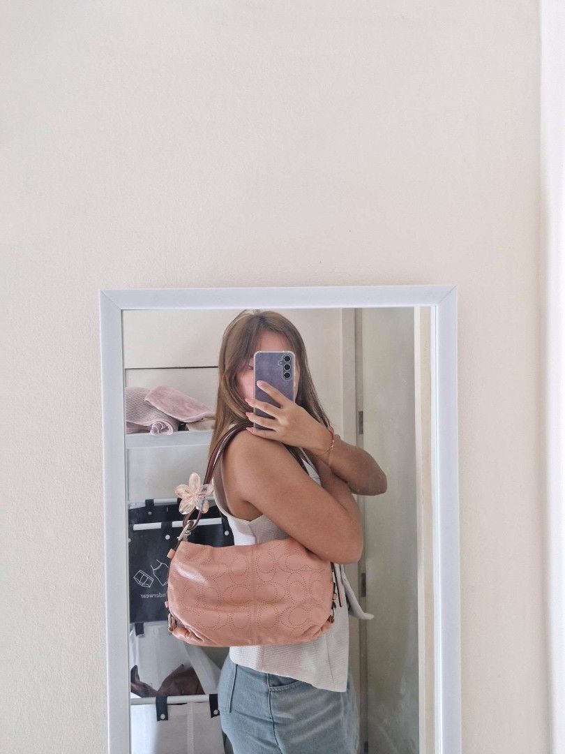 Coach Pink Leather Shoulder Bag (Category: Luxury Bags & Wallets) located in Baguio. Submitted by isla.fabrics (Listing ID 1435161938, Image 3). Description: - Coach hobo bag - Light peach color / cute pink color! - A vintage find! - Adjustable strap, can make it longer! very cute and unique color! perfect for any occassion, very good condition (price is negotiable) rfs: decluterring! too many shopped items that i don't even use :,(.