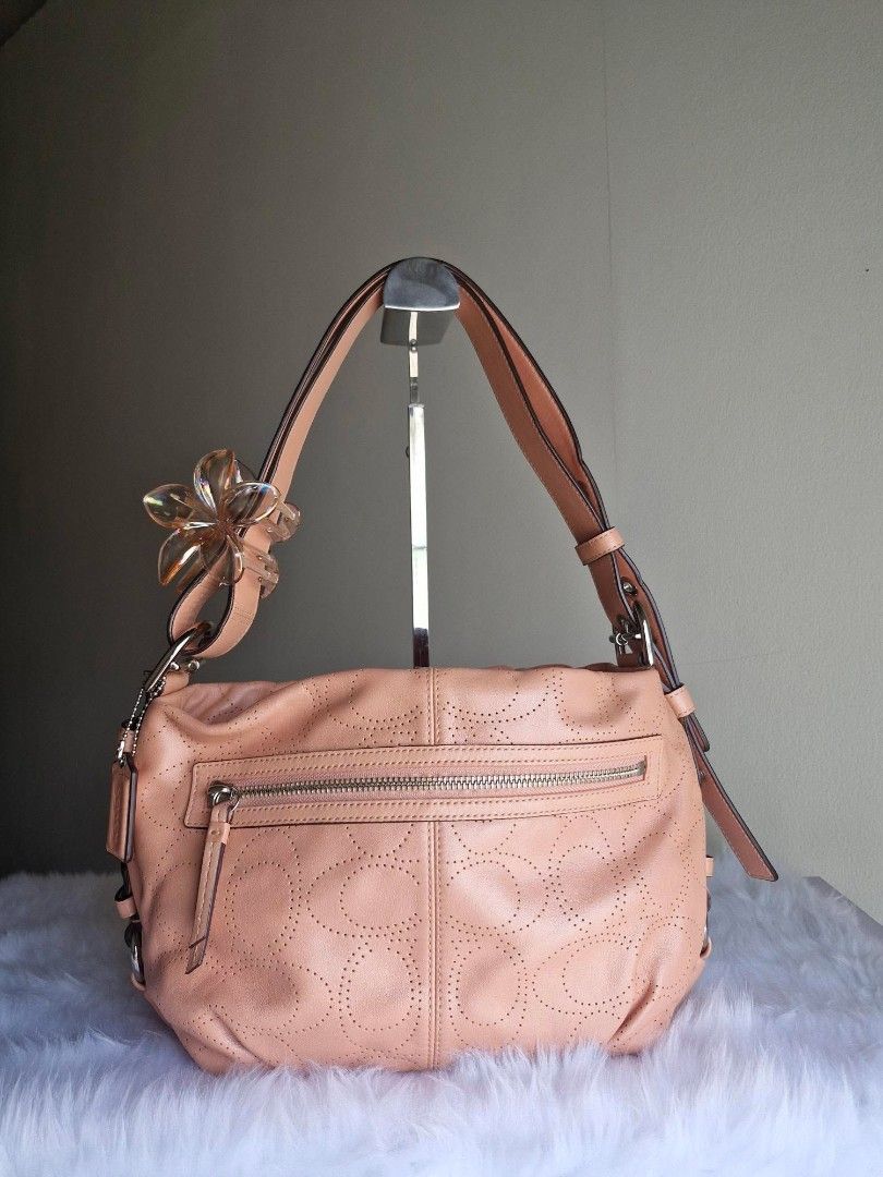 Coach Pink Leather Shoulder Bag (Category: Luxury Bags & Wallets) located in Baguio. Submitted by isla.fabrics (Listing ID 1435161938, Image 2). Description: - Coach hobo bag - Light peach color / cute pink color! - A vintage find! - Adjustable strap, can make it longer! very cute and unique color! perfect for any occassion, very good condition (price is negotiable) rfs: decluterring! too many shopped items that i don't even use :,(.