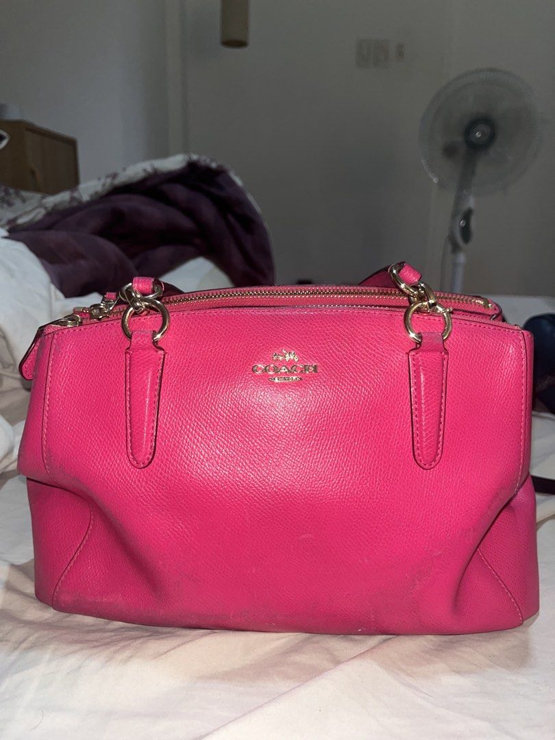 Coach Pink Satchel Handbag (Category: Luxury Bags & Wallets) located in Manila. Submitted by sethsethsethseth (Listing ID 1435120153, Image 1). Description: - Authentic Coach satchel handbag - Vibrant pink color - Top zipper closure - Dual top handles - Interior: main compartment and small pocket - Includes Coach hangtag - Material: Leather - Gold-tone hardware BUYING MORE THAN 1 ITEM WILL BE OFFERED DISCOUNTS. Note: slight discoloration due to h