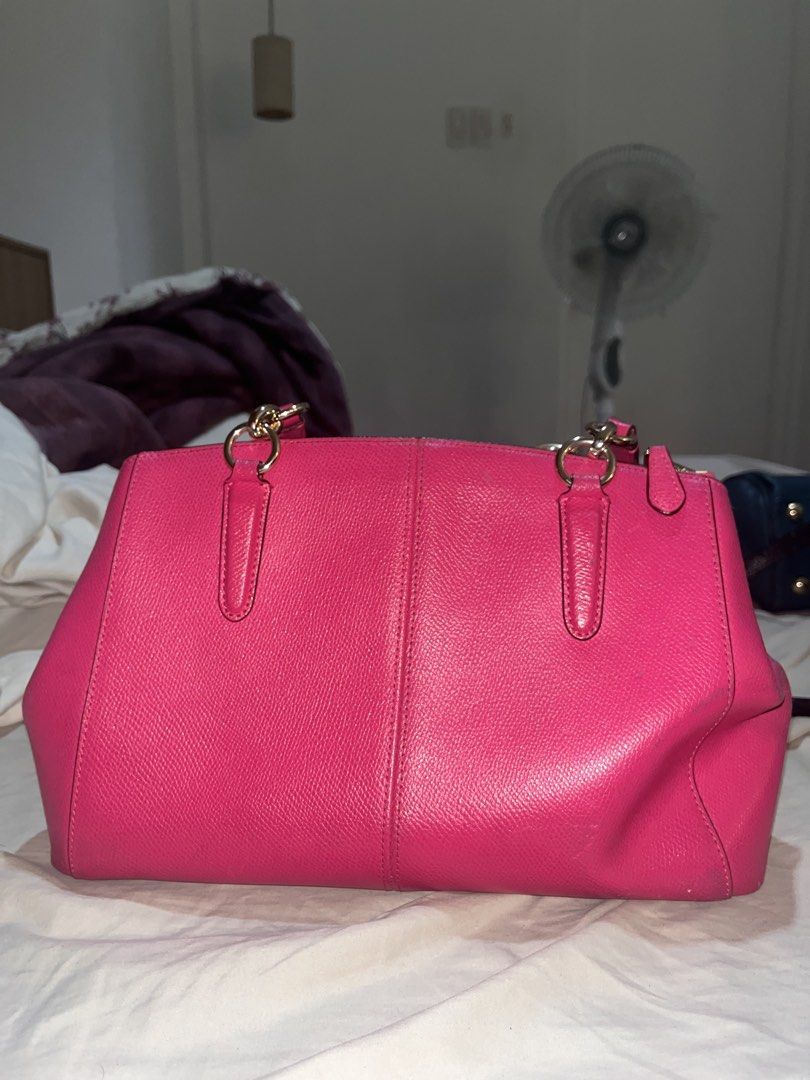 Coach Pink Satchel Handbag (Category: Luxury Bags & Wallets) located in Manila. Submitted by sethsethsethseth (Listing ID 1435120153, Image 2). Description: - Authentic Coach satchel handbag - Vibrant pink color - Top zipper closure - Dual top handles - Interior: main compartment and small pocket - Includes Coach hangtag - Material: Leather - Gold-tone hardware BUYING MORE THAN 1 ITEM WILL BE OFFERED DISCOUNTS. Note: slight discoloration due to h