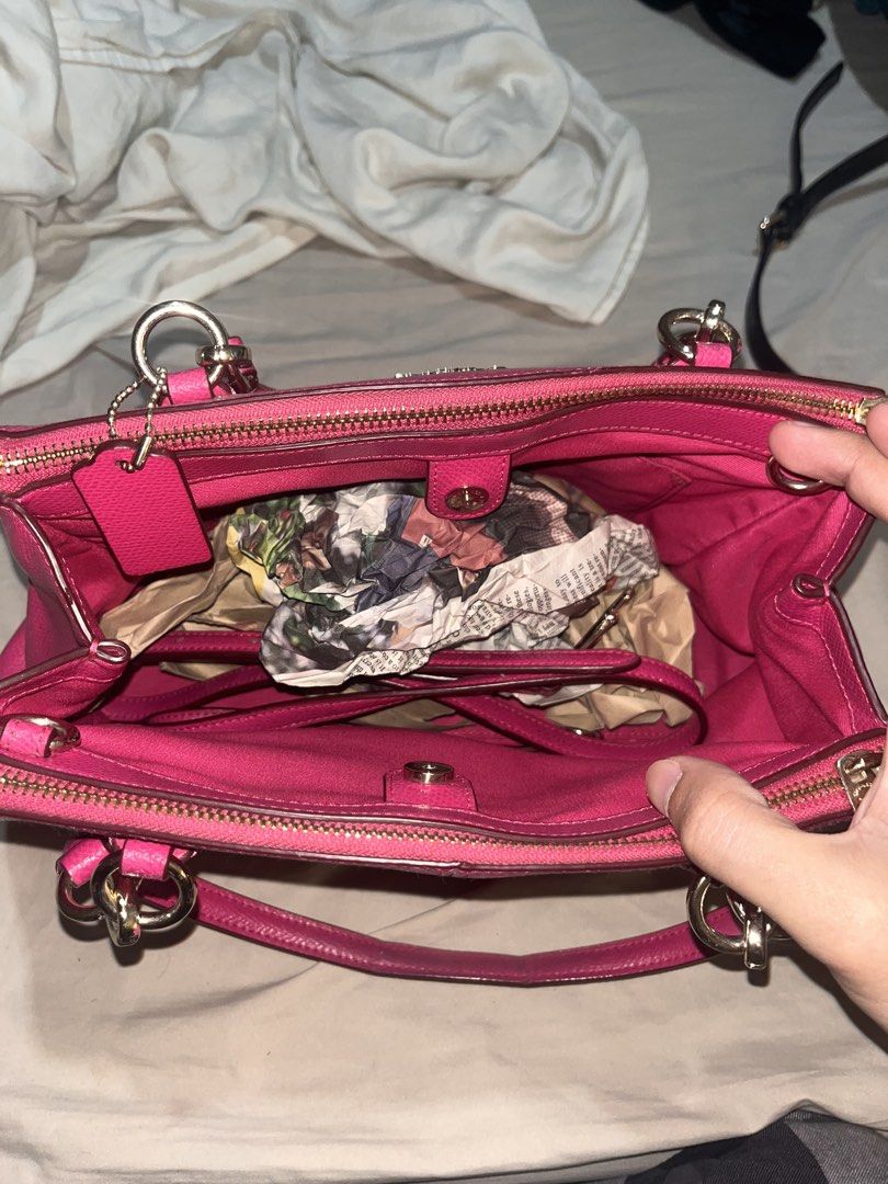 Coach Pink Satchel Handbag (Category: Luxury Bags & Wallets) located in Manila. Submitted by sethsethsethseth (Listing ID 1435120153, Image 3). Description: - Authentic Coach satchel handbag - Vibrant pink color - Top zipper closure - Dual top handles - Interior: main compartment and small pocket - Includes Coach hangtag - Material: Leather - Gold-tone hardware BUYING MORE THAN 1 ITEM WILL BE OFFERED DISCOUNTS. Note: slight discoloration due to h