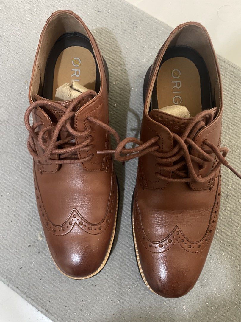 Cole Haan Grand OS Wingtip Shoes (Category: Dress Shoes) located in Cainta. Submitted by jericot (Listing ID 1435166264, Image 1). Description: Cole Haan OriginalGrand Wingtip Size: UK7/US8 EU41 Used twice or three times sa office Collecting dust No box Price is negotiable Brown Cole Haan wingtip shoes. Features a leather upper with decorative perforations. The soles are dark brown with the Cole Haan Grand OS logo. The shoes have a lace-up closur