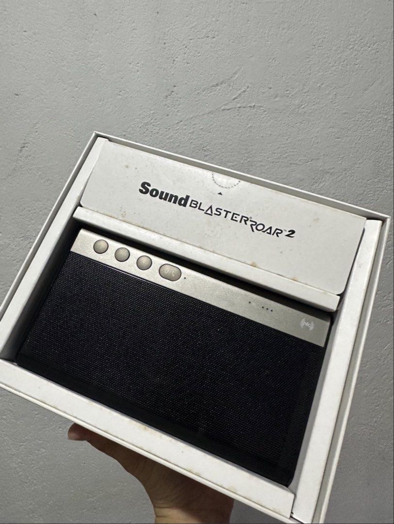 Creative Sound Blaster Roar 2 Bluetooth Speaker (Category: Soundbars, Speakers & Amplifiers) located in Manila. Submitted by keishache04272 (Listing ID 1435165826, Image 1). Description: - Creative Sound Blaster Roar 2 Bluetooth speaker - Includes speaker and charger - Comes in original box - Features: - Volume control - Playback control - Multiple ports - Design: Black front, silver top Bought in Singapore. Used a couple of times with free pouch
