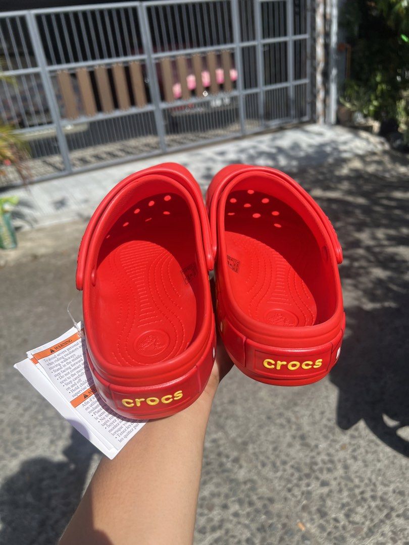 Crocs Lightning McQueen Clogs (Category: Slippers & Slides) located in Sariaya. Submitted by IvanYuri07 (Listing ID 1435047338, Image 3). Description: - Bright red Crocs clogs - Lightning McQueen design - Features the number "95" - Character eyes on the front - Crocs logo on the heel - Includes original tag mcqueen crocs size 8 men size 10 women wrong size lang dumating.