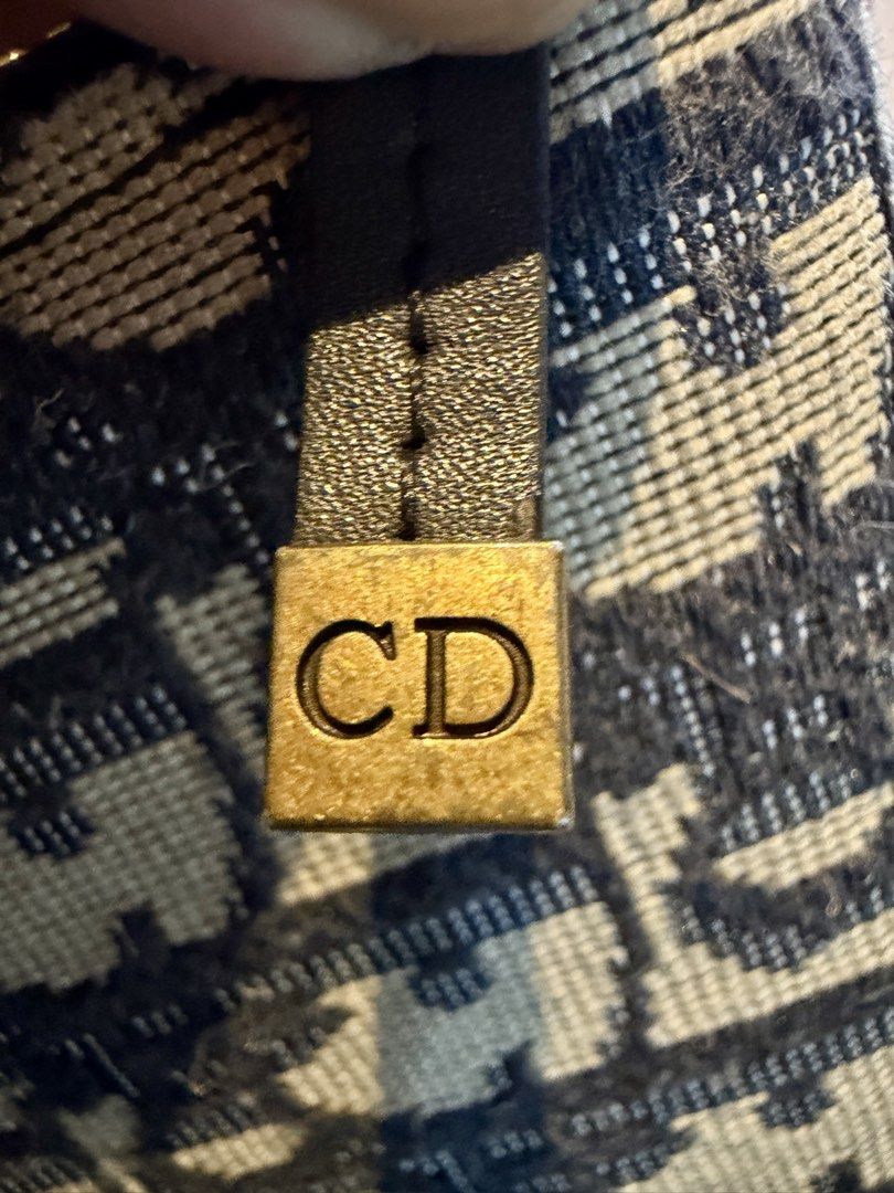 Dior Oblique Canvas Zip Wallet (Category: Luxury Bags & Wallets) located in Binangonan. Submitted by joizeeful (Listing ID 1435170364, Image 3). Description: - Dior zip wallet - Iconic Oblique canvas - Gold-tone CD logo - Matching zipper - Includes dust bag - Multiple card slots - Zippered compartment - Dior logo engraved on zipper pull .