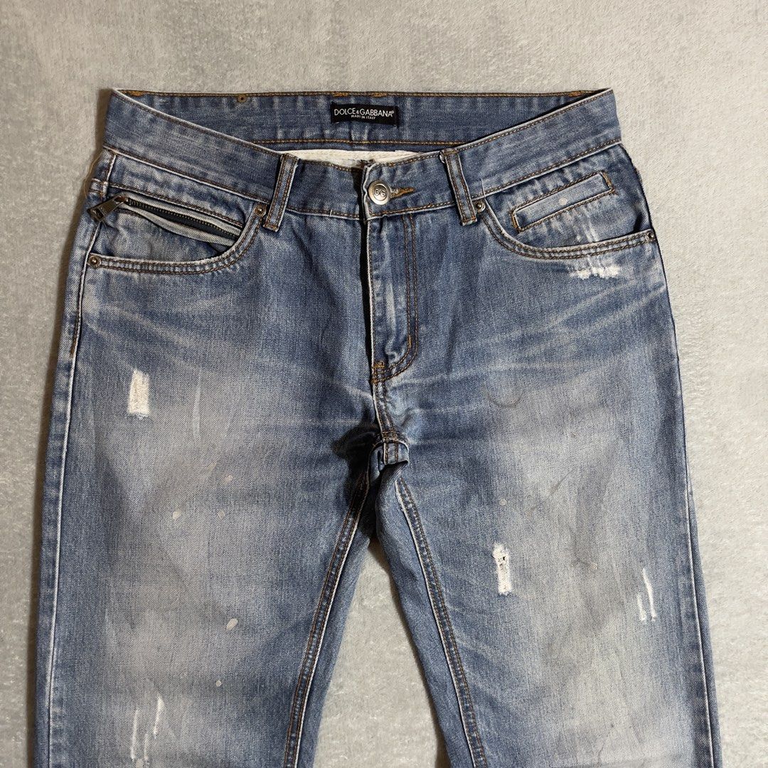 Dolce & Gabbana Distressed Jeans (Category: Jeans) located in Bayombong. Submitted by rochelle_archive_garments (Listing ID 1435159903, Image 3). Description: - Authentic Dolce & Gabbana jeans - Light blue wash - Zip pocket detail - Distressed accents - Classic five-pocket design - Button and zip fly closure - Brand name visible on waistband - Stylish and versatile.