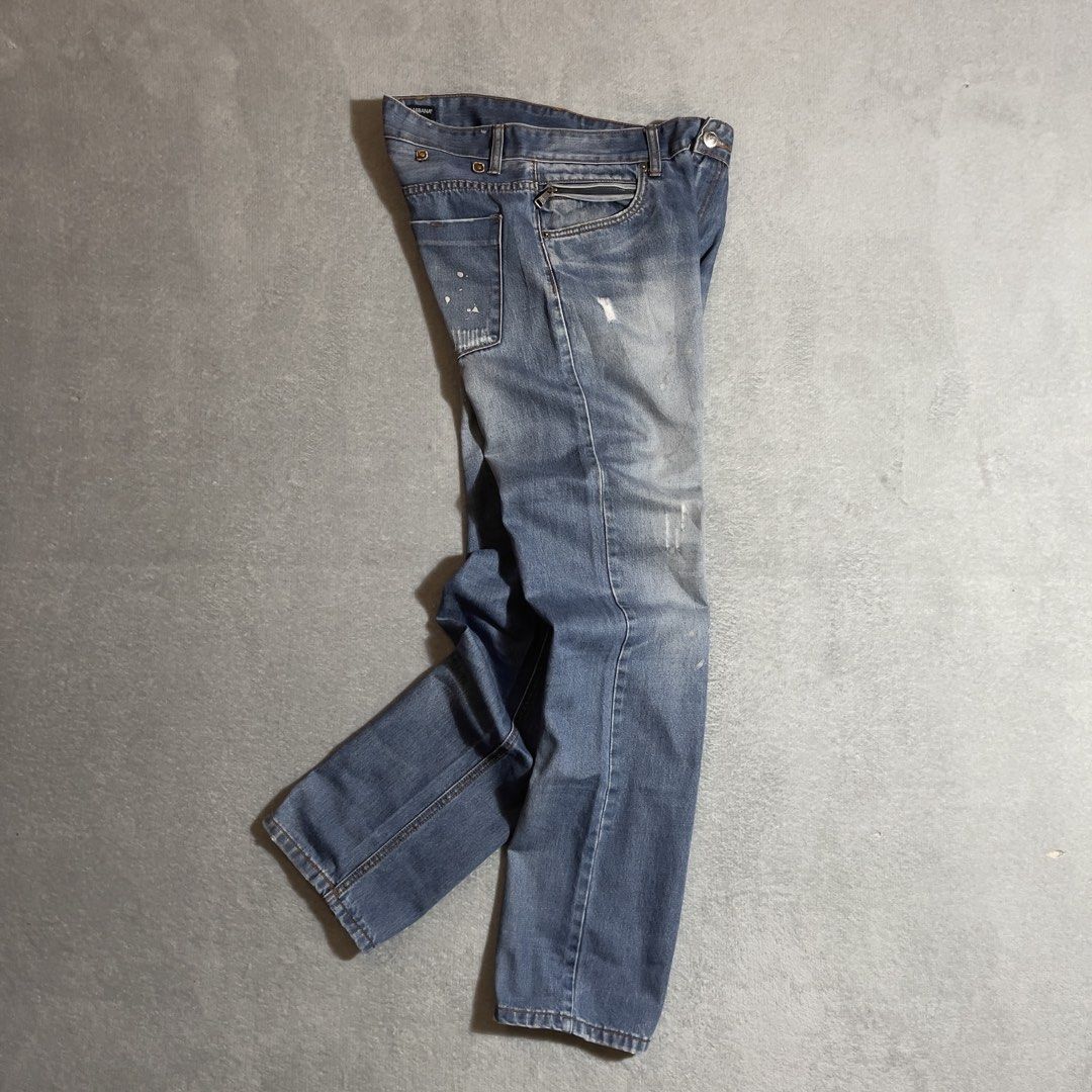 Dolce & Gabbana Distressed Jeans (Category: Jeans) located in Bayombong. Submitted by rochelle_archive_garments (Listing ID 1435159903, Image 2). Description: - Authentic Dolce & Gabbana jeans - Light blue wash - Zip pocket detail - Distressed accents - Classic five-pocket design - Button and zip fly closure - Brand name visible on waistband - Stylish and versatile.