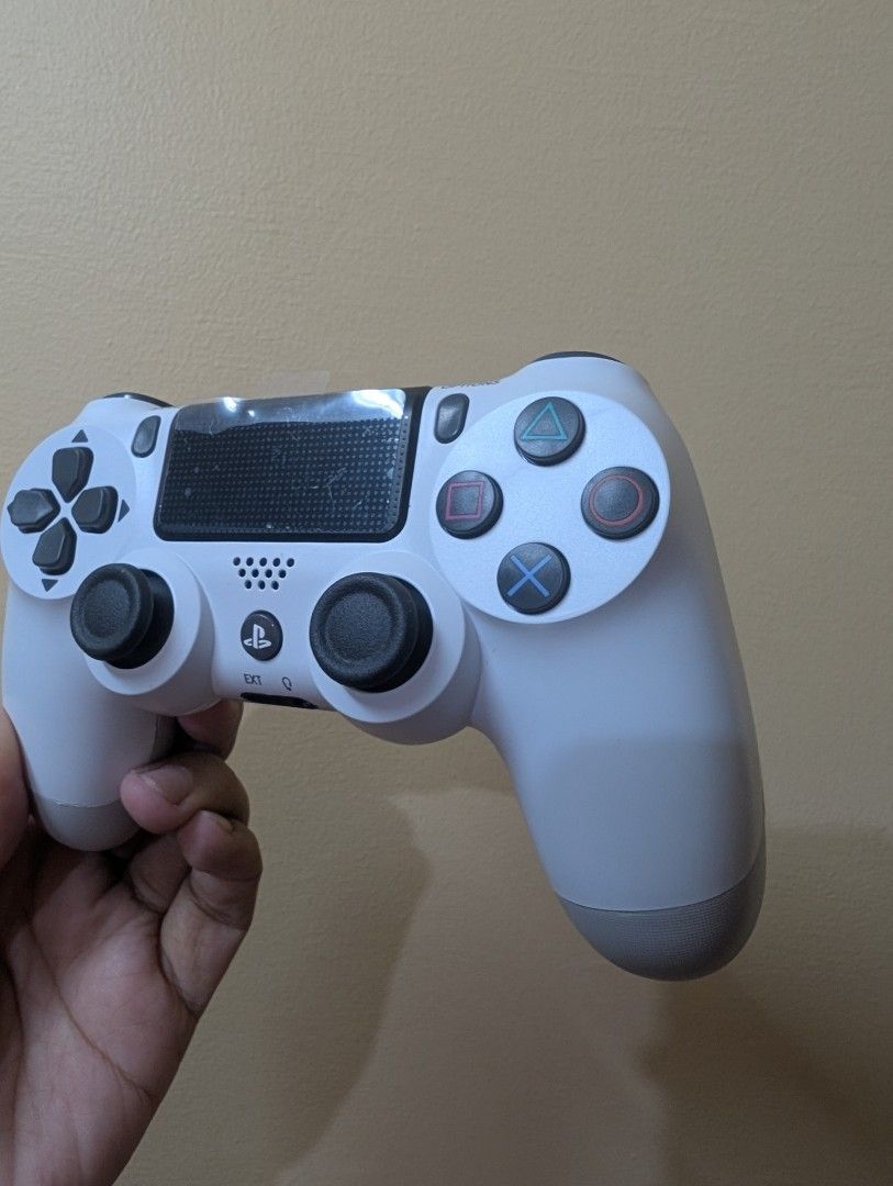 DualShock 4 Wireless Controller for PS4 (Category: Controllers) located in Quezon City. Submitted by unboxingtito (Listing ID 1435079526, Image 3). Description: With box and charging cable.
