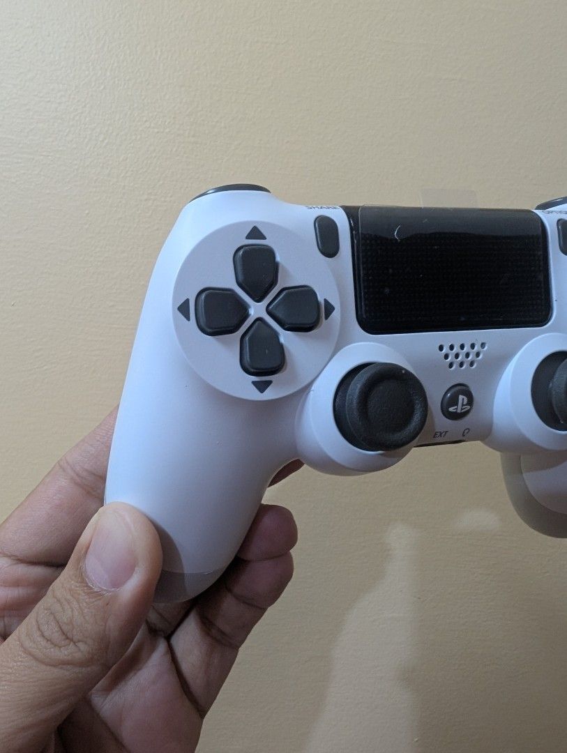 DualShock 4 Wireless Controller for PS4 (Category: Controllers) located in Quezon City. Submitted by unboxingtito (Listing ID 1435079526, Image 2). Description: With box and charging cable.