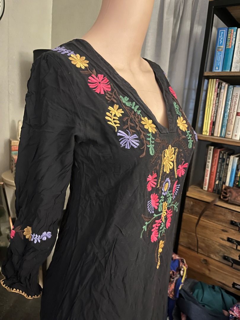 Embroidered Flower Black Daster Dress (Category: Dresses) located in Mandaluyong City. Submitted by pattyph (Listing ID 1435112741, Image 2). Description: - Black dress with intricate floral embroidery - Features a V-neckline - Long sleeves with gathered cuffs - Embroidery colors: pink, yellow, purple - Made of lightweight fabric - Suitable for various occasions.