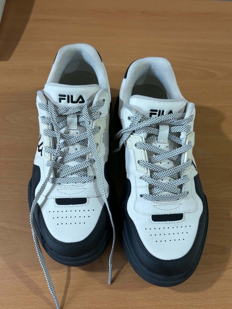 Fila Sneakers Black and White (Category: Sneakers) located in Paranaque City. Submitted by marivaal06972 (Listing ID 1435150160, Image 1). Description: - Only worn twice - Black and white color - Thick black sole - White laces - Mix of smooth and perforated leather.