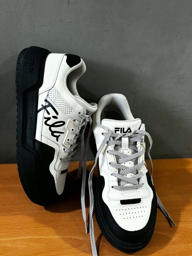 Fila Sneakers Black and White (Category: Sneakers) located in Paranaque City. Submitted by marivaal06972 (Listing ID 1435150160, Image 2). Description: - Only worn twice - Black and white color - Thick black sole - White laces - Mix of smooth and perforated leather.