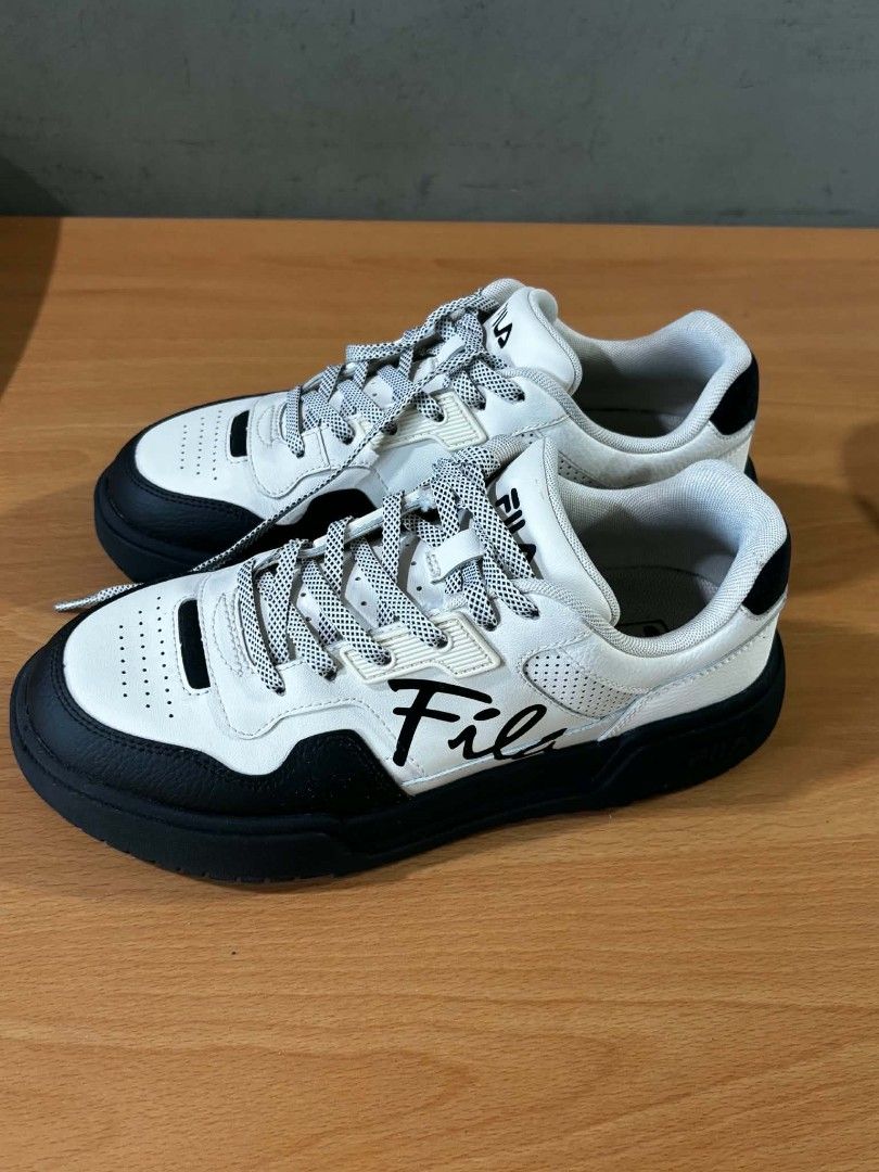 Fila Sneakers Black and White (Category: Sneakers) located in Paranaque City. Submitted by marivaal06972 (Listing ID 1435150160, Image 3). Description: - Only worn twice - Black and white color - Thick black sole - White laces - Mix of smooth and perforated leather.