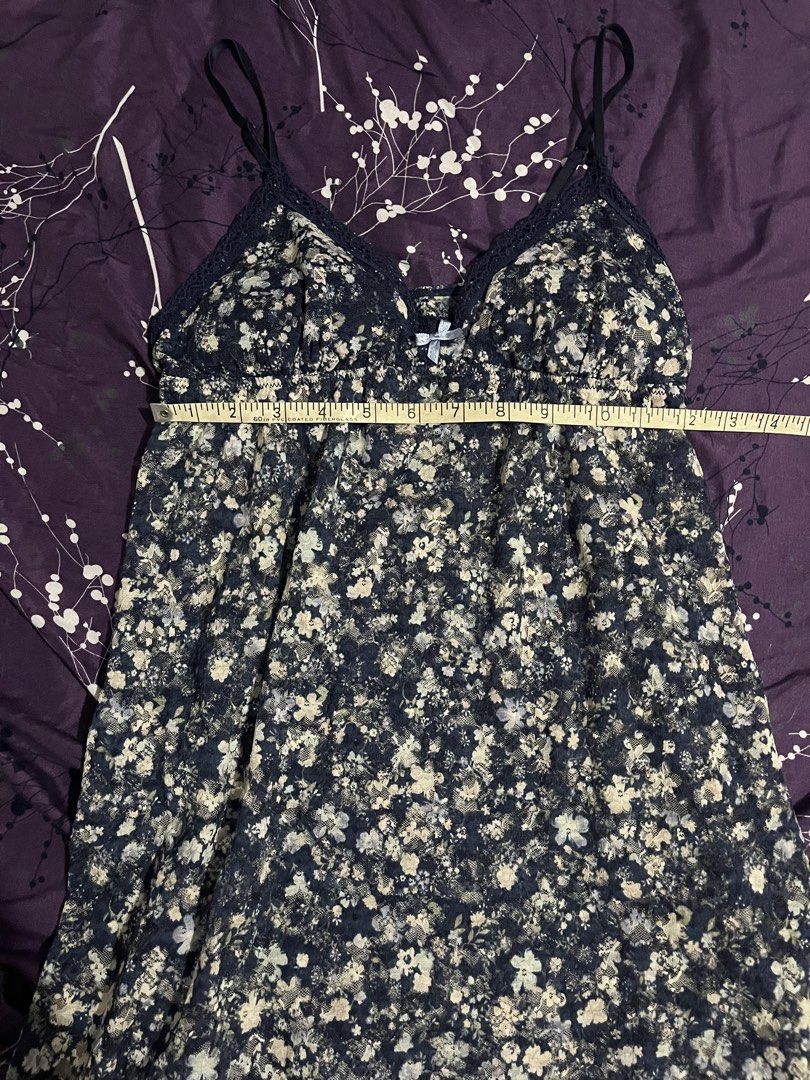 Floral Padded Cami Dress (Category: Dresses) located in Kawit. Submitted by akcmrc (Listing ID 1435163244, Image 3). Description: 📍Kawit, Cavite - Navy blue cami dress - Delicate floral print - Adjustable straps - Lace trim neckline - Bow detail at bust - Lightweight fabric - Measurements in photos.