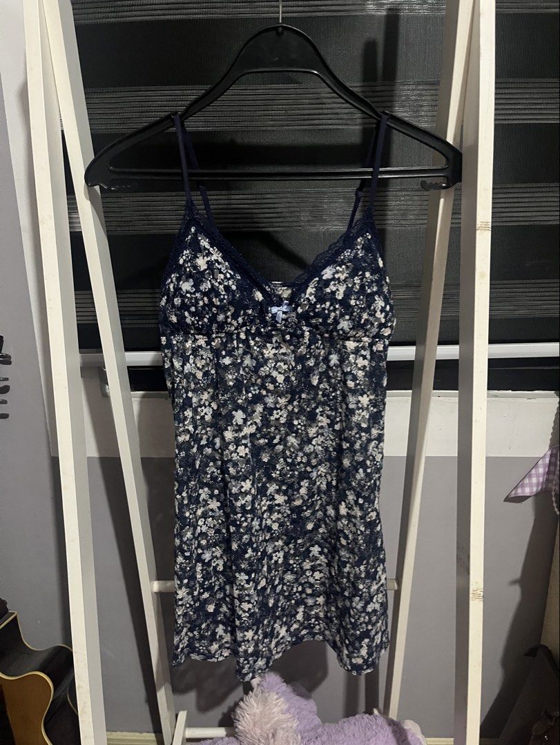 Floral Padded Cami Dress (Category: Dresses) located in Kawit. Submitted by akcmrc (Listing ID 1435163244, Image 1). Description: 📍Kawit, Cavite - Navy blue cami dress - Delicate floral print - Adjustable straps - Lace trim neckline - Bow detail at bust - Lightweight fabric - Measurements in photos.