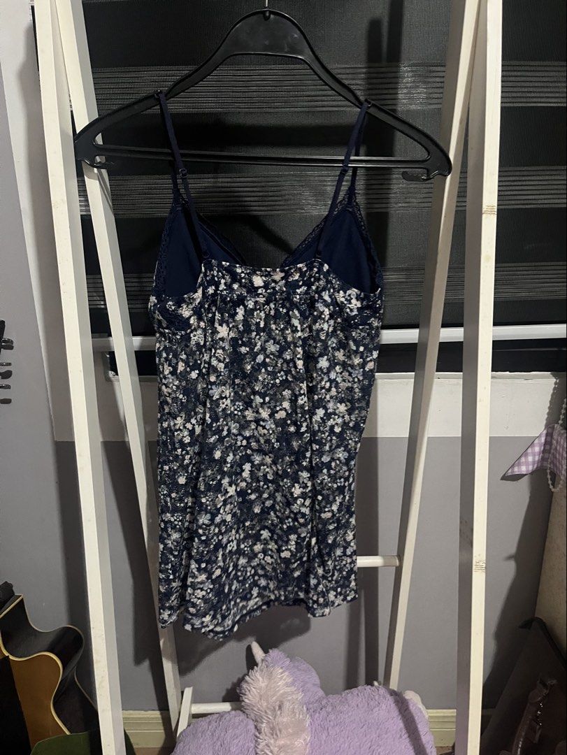 Floral Padded Cami Dress (Category: Dresses) located in Kawit. Submitted by akcmrc (Listing ID 1435163244, Image 2). Description: 📍Kawit, Cavite - Navy blue cami dress - Delicate floral print - Adjustable straps - Lace trim neckline - Bow detail at bust - Lightweight fabric - Measurements in photos.