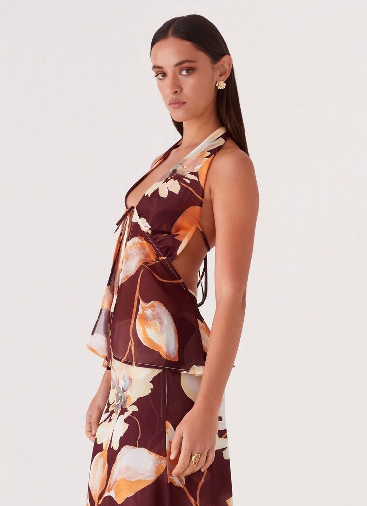 FOR RENT: Peppermayo floral halter top (Category: Sleeveless) located in Taguig. Submitted by batmanssidehoe (Listing ID 1435104839, Image 3). Description: Rent for 3 days: 350 pesos (+100 extra day) Sec deposit: 1,000 pesos (will be returned once top is returned without damages or stains).