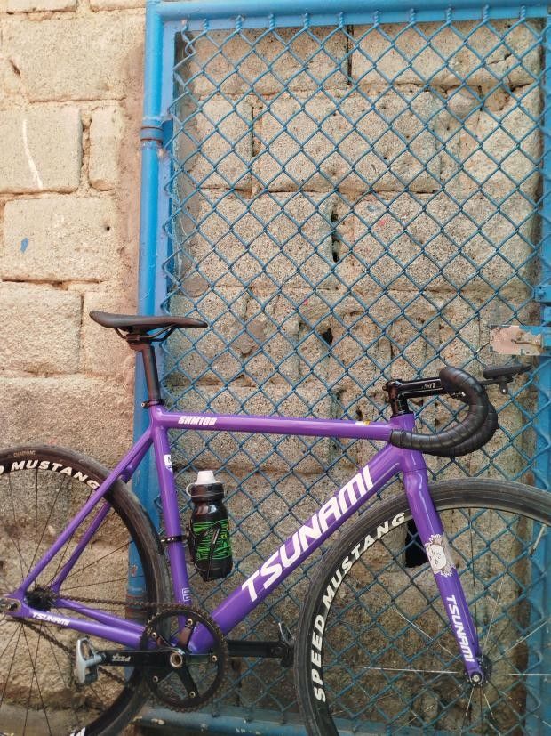 For sale tsunami snm100 (Category: Bicycles) located in Manila. Submitted by knitura (Listing ID 1435155806, Image 2). Description: Tsunami v2 snm 100 (violet cw) -M Uno drop 38 Uno stem 110 ±7 Seatpost saddle (unknown) Pizz v2 x 49t chainring pizz Did chain Speedmustang x 16t pizz cog (w/13t ordinary cog) F/r Chaoyang hippo skin 28c.