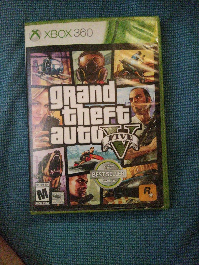 Grand Theft Auto V [XBOX 360] NTSC-J (Category: Xbox) located in Infanta. Submitted by acecarrot07 (Listing ID 1435006497, Image 1). Description: - Grand Theft Auto V for Xbox 360 - Includes game disc, map, and case - Features Grand Theft Auto Online - Rated M (Mature) - Published by Rockstar Games - Game case with green border - Disc still in original packaging -NTSC-J -HAS SCRATCHES ON THE CD BUT WE WERE STILL ABLE TO PLAY AND FINISH THE GAME W