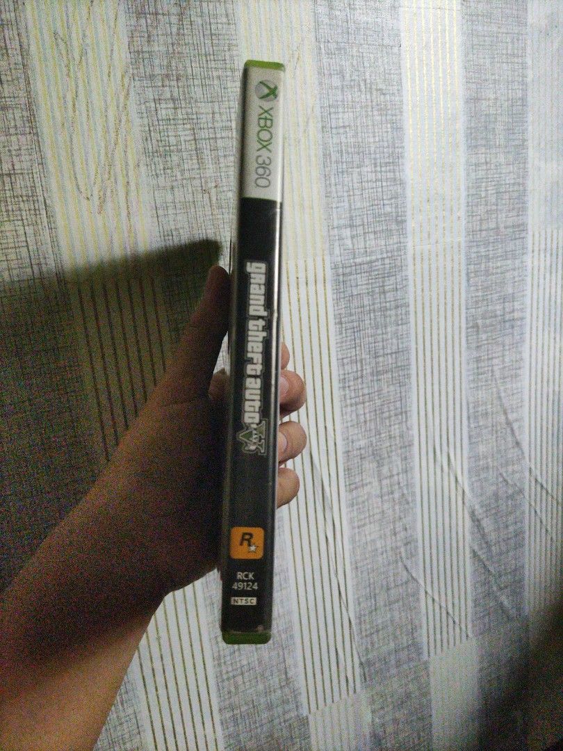 Grand Theft Auto V [XBOX 360] NTSC-J (Category: Xbox) located in Infanta. Submitted by acecarrot07 (Listing ID 1435006497, Image 3). Description: - Grand Theft Auto V for Xbox 360 - Includes game disc, map, and case - Features Grand Theft Auto Online - Rated M (Mature) - Published by Rockstar Games - Game case with green border - Disc still in original packaging -NTSC-J -HAS SCRATCHES ON THE CD BUT WE WERE STILL ABLE TO PLAY AND FINISH THE GAME W