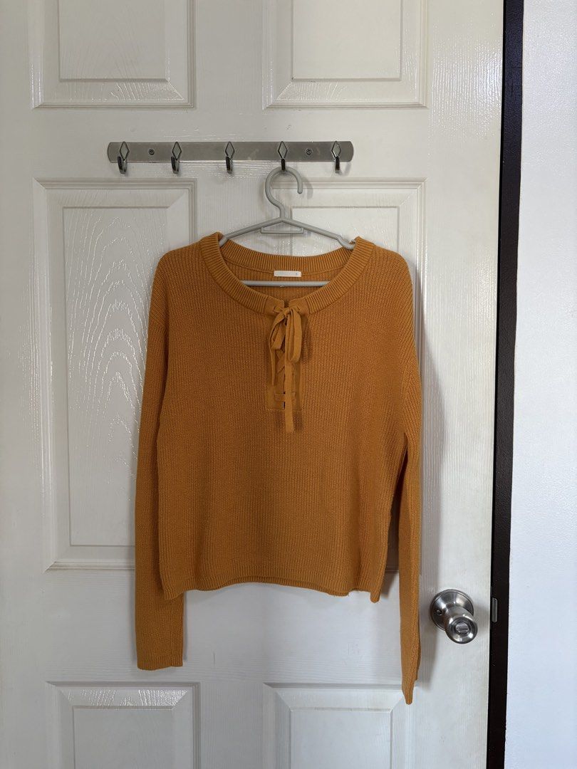 GU Mustard Yellow Knit Sweater (Category: Longsleeves) located in Angeles City. Submitted by classictop (Listing ID 1435068777, Image 1). Description: Mustard yellow knit sweater from GU. Features a lace-up detail at the neckline. Like new Size: Small RFS: outgrown/size M na ako :( Super nice ang color!.