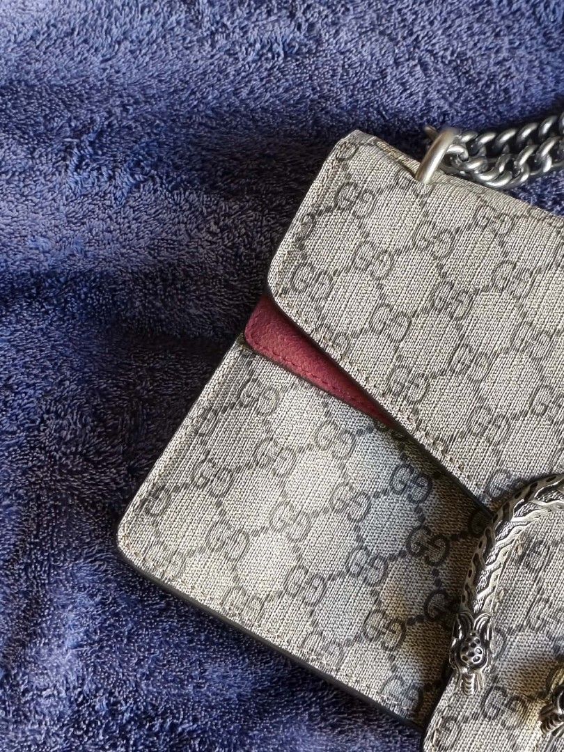 Gucci Dionysus Shoulder Bag (Category: Luxury Bags & Wallets) located in Manila. Submitted by silenttiger.68023a (Listing ID 1435109910, Image 3). Description: - Authentic Gucci Dionysus shoulder bag - Iconic tiger head closure - Chain strap - Signature Gucci logo pattern - Deep red interior - Zipper closure - Interior tag: Gucci logo and "Made in Italy".