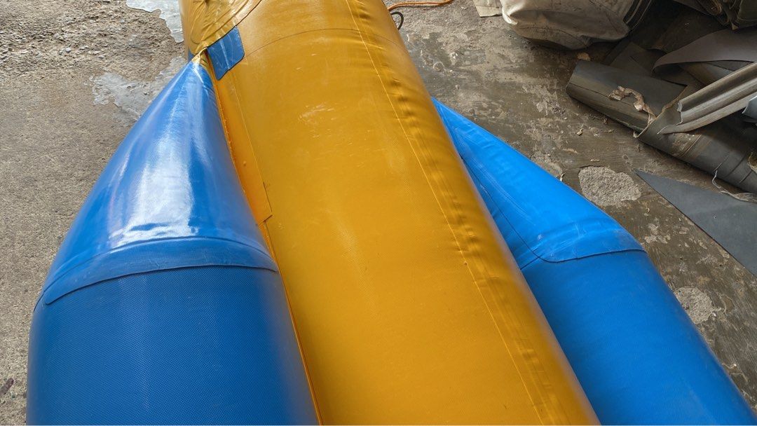 Inflatable Banana Boat 8 seater (Category: Water Sports) located in Alaminos. Submitted by wavemaxter (Listing ID 1435038285, Image 3). Description: - Inflatable banana boat for water fun. - Eye-catching yellow and blue design. - Features multiple seats and handles. - Made of durable material. - Suitable for lakes, rivers, and ocean use. - Provides a thrilling recreational experience.f Made of heavy duty PVC, thickness-0.9mm 3 air chamber All wel