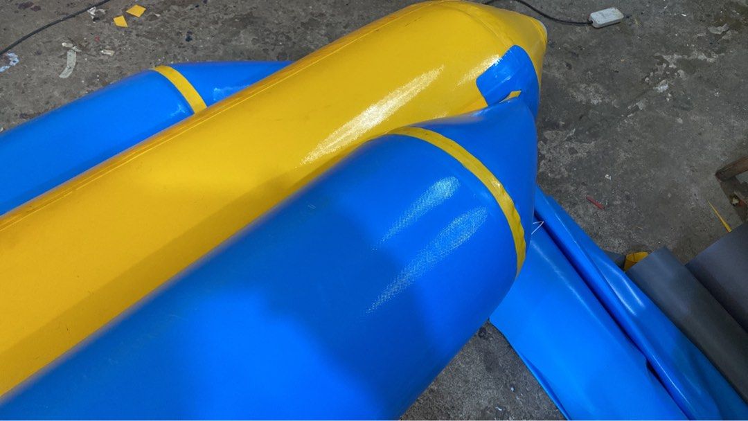 Inflatable Banana Boat 8 seater (Category: Water Sports) located in Alaminos. Submitted by wavemaxter (Listing ID 1435038285, Image 2). Description: - Inflatable banana boat for water fun. - Eye-catching yellow and blue design. - Features multiple seats and handles. - Made of durable material. - Suitable for lakes, rivers, and ocean use. - Provides a thrilling recreational experience.f Made of heavy duty PVC, thickness-0.9mm 3 air chamber All wel