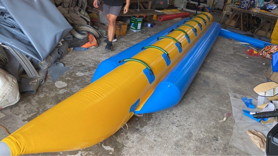 Inflatable Banana Boat 8 seater (Category: Water Sports) located in Alaminos. Submitted by wavemaxter (Listing ID 1435038285, Image 1). Description: - Inflatable banana boat for water fun. - Eye-catching yellow and blue design. - Features multiple seats and handles. - Made of durable material. - Suitable for lakes, rivers, and ocean use. - Provides a thrilling recreational experience.f Made of heavy duty PVC, thickness-0.9mm 3 air chamber All wel