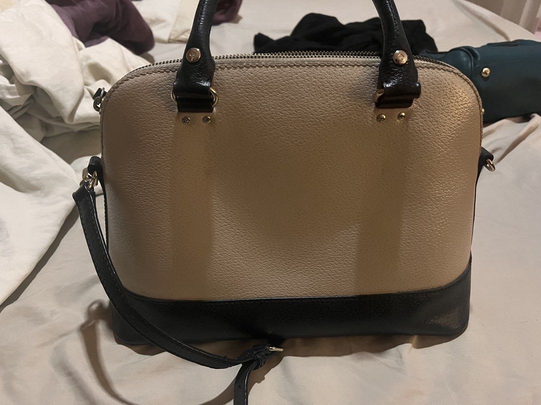 Kate Spade Dome Satchel Handbag (Category: Luxury Bags & Wallets) located in Manila. Submitted by sethsethsethseth (Listing ID 1435119946, Image 2). Description: - Kate Spade dome satchel - Color: Beige and black - Features: - Top handle - Detachable shoulder strap - Zip closure - Multiple interior pockets - Gold-tone hardware - Interior lined with patterned fabric - Kate Spade logo on front BUYING MORE THAN 1 ITEM WILL BE OFFERED DISCOUNTS..