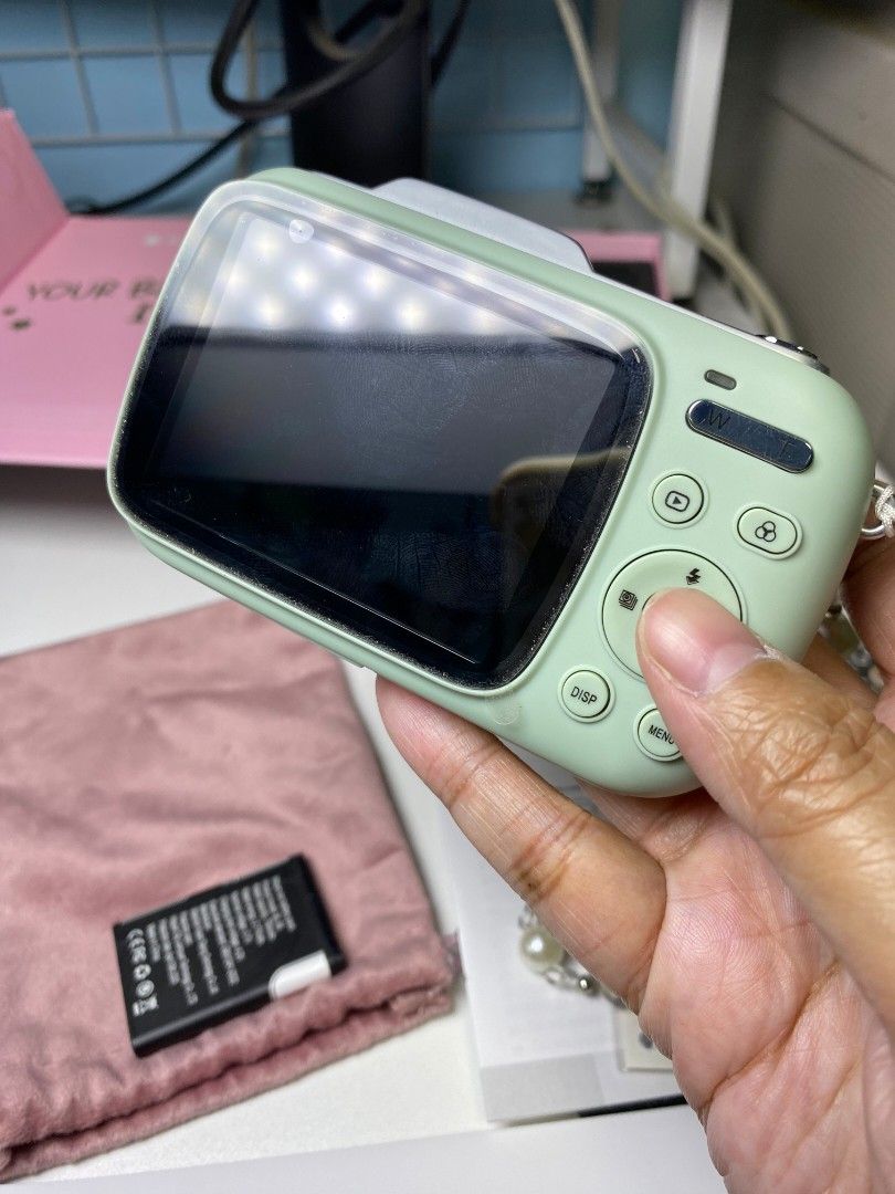 KitBEEZ Digital Camera (Category: Cameras) located in Manila. Submitted by enjdg12 (Listing ID 1435135604, Image 3). Description: - Mint green KitBEEZ digital camera - Features screen and buttons - Includes battery - Comes with a pink carrying case - Includes original box ('Your Bestie is Here') - Includes strap - Includes stickers -slightly nego like new mop: gcash or maya lalamove or grab only loc: imus cavite.