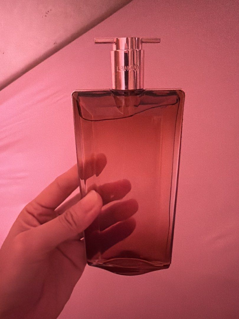 Lancome Idole Eau de Parfum 100 ML (AUTHENTIC) (Category: Fragrance & Deodorants) located in Manila. Submitted by plsbuymyoldthingsheheh (Listing ID 1435169606, Image 2). Description: - Lancome Idole Eau de Parfum - Features a sleek, rectangular bottle design. - Bottle has a stylish brown gradient. - Silver cap with the Lancome brand name. - Clear glass bottle showcasing the perfume. - Authentic and brand new. - MONEY BACK IF PROVEN FAKE - Used l