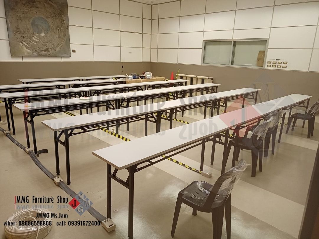 Long Folding Tables (Category: Tables & Sets) located in Caloocan City. Submitted by brightgem-d4ebba (Listing ID 1435010581, Image 3). Description: Durable long folding tables with white tabletops and black metal frames. Suitable for various events and gatherings. The tables are designed for easy setup and storage. Contact the seller for inquiries..