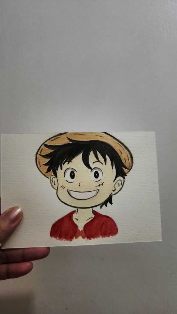Luffy Anime Artwork (Category: Art & Prints) located in Cavite. Submitted by joycreates (Listing ID 1435048375, Image 2). Description: - Hand-painted artwork of Luffy from One Piece. - Features Luffy's face with his straw hat and a big smile. - Artwork is on paper. - Frame not included. - Great for anime fans and collectors..