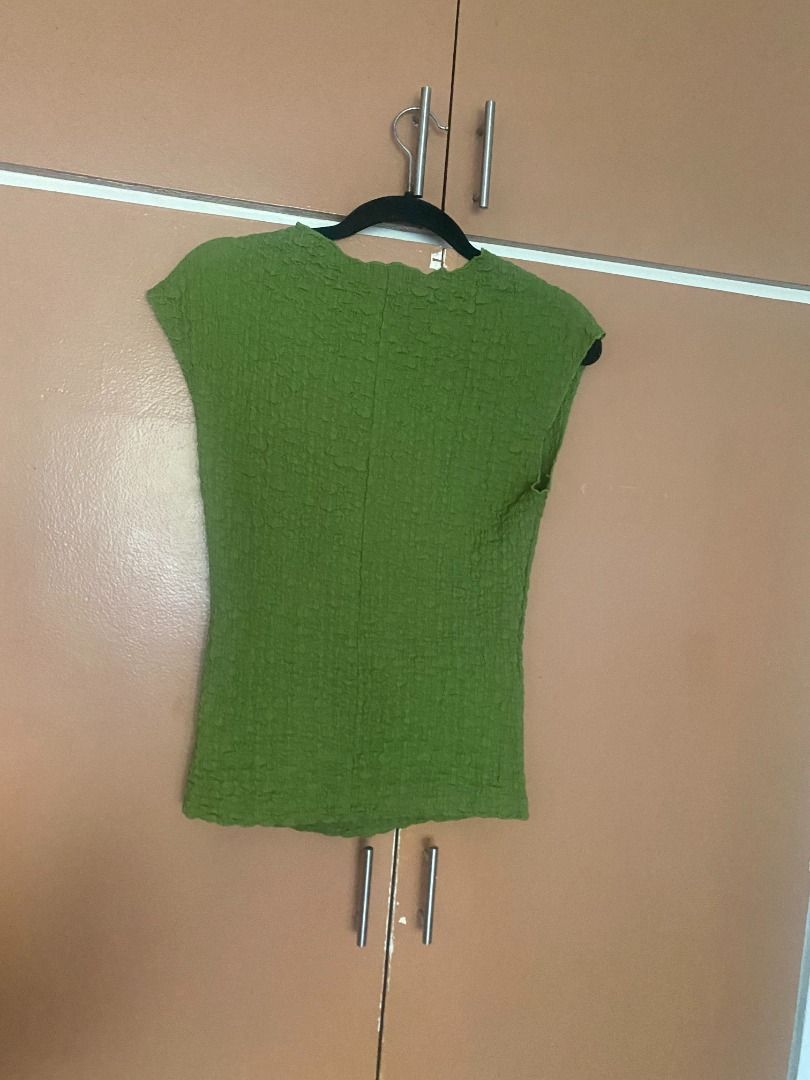 Mango Green Textured Top (Category: Blouses) located in Mandaluyong City. Submitted by ja.declutters (Listing ID 1435077345, Image 2). Description: - Mango green textured top - Round neckline - Unique crinkled texture - Dress up or down.
