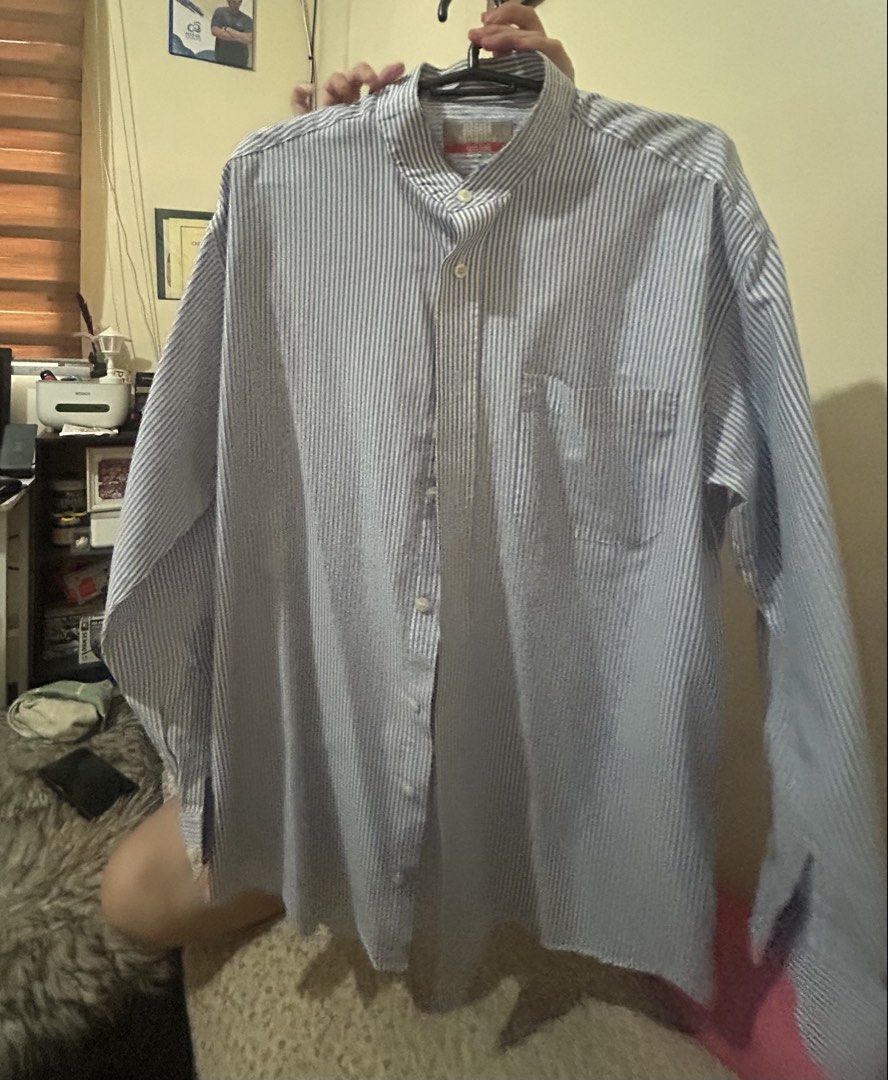 Marks & Spencer Striped Long Sleeve Shirt (Category: Tshirts & Polo Shirts ) located in Quezon City. Submitted by raki17 (Listing ID 1435008416, Image 3). Description: - Marks & Spencer long sleeve shirt - Blue and white stripes - Mandarin collar - Single chest pocket - Buttoned cuffs - Size: Large - Lightweight fabric - Suitable for casual or semi-formal wear.