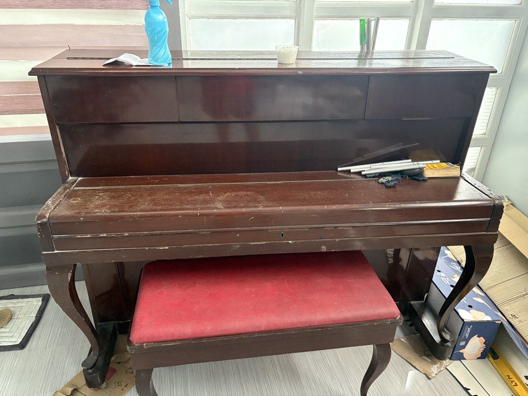 Mercedes Piano with Bench (Category: Musical Instruments) located in Makati City. Submitted by lyncervph (Listing ID 1435092965, Image 2). Description: FOR SALE! FOR SALE! Mercedes Piano for P 10,000 🕹️ San Pedro Laguna Pm for details. Thank you - Upright piano with matching bench - Brand: Mercedes - Finish: Dark wood - Keyboard: Full size - Bench: Red cushioned seat - Condition: Some dust present Note: for pick up only or delivery fee will be s