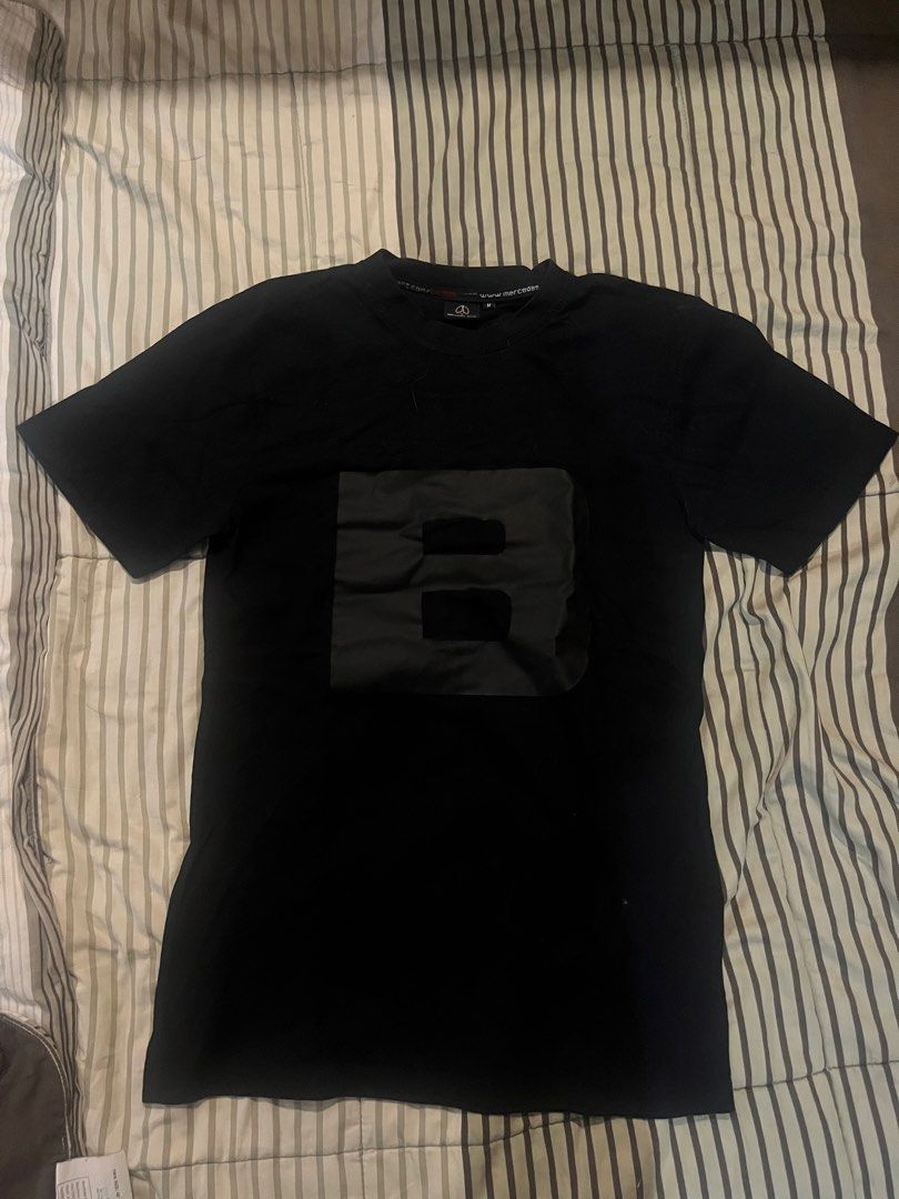 Mercedes-Benz B-Class T-Shirt (Category: Tshirts & Polo Shirts ) located in Manila. Submitted by domsyy (Listing ID 1435155994, Image 1). Description: - Black Mercedes-Benz B-Class T-shirt - Size: M - 27x18 - Features a large 'B' design on the front - Crew neck and short sleeves - Includes Mercedes-Benz logo on neck tag.