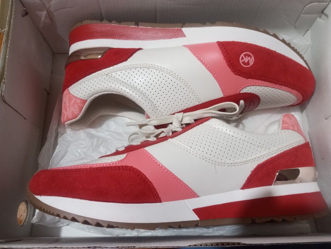 Michael Kors Andi Trainer Sneakers - US 8.5M (Category: Sneakers) located in Baguio. Submitted by mclilospantry (Listing ID 1435120688, Image 3). Description: - Authentic Michael Kors Andi Trainer sneakers - Size: US 8.5M - Color scheme: Red, white, and pink - Features the Michael Kors logo - Brown soles - Includes original box.